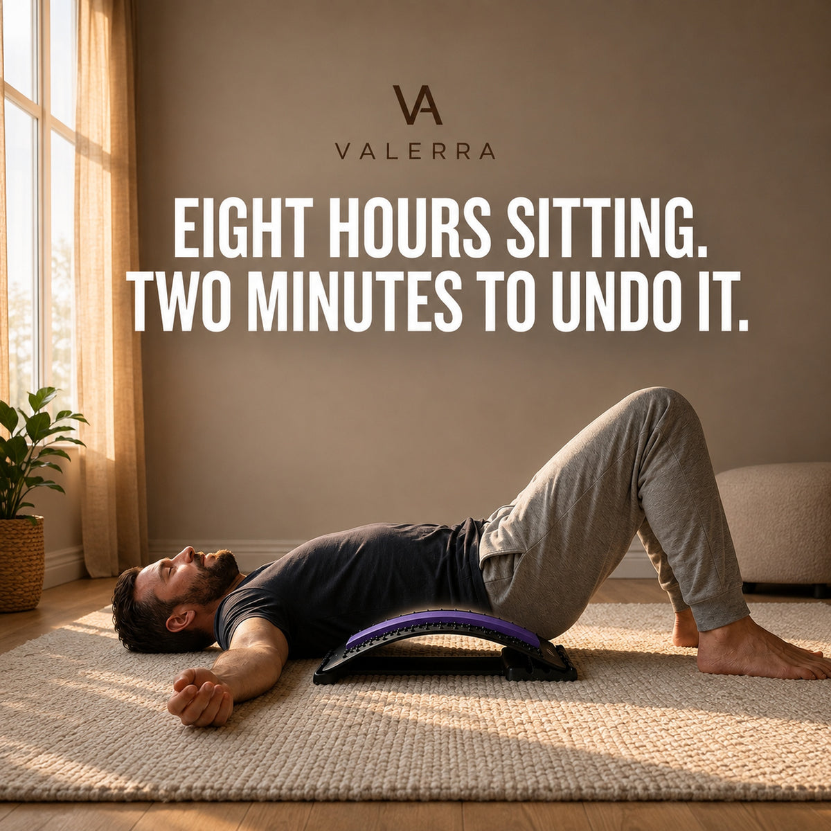 Man using the Valerra back stretcher on the floor after a day of sitting
